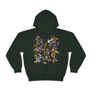 May include: A dark green hooded sweatshirt with a colourful pressed flower design on the back.