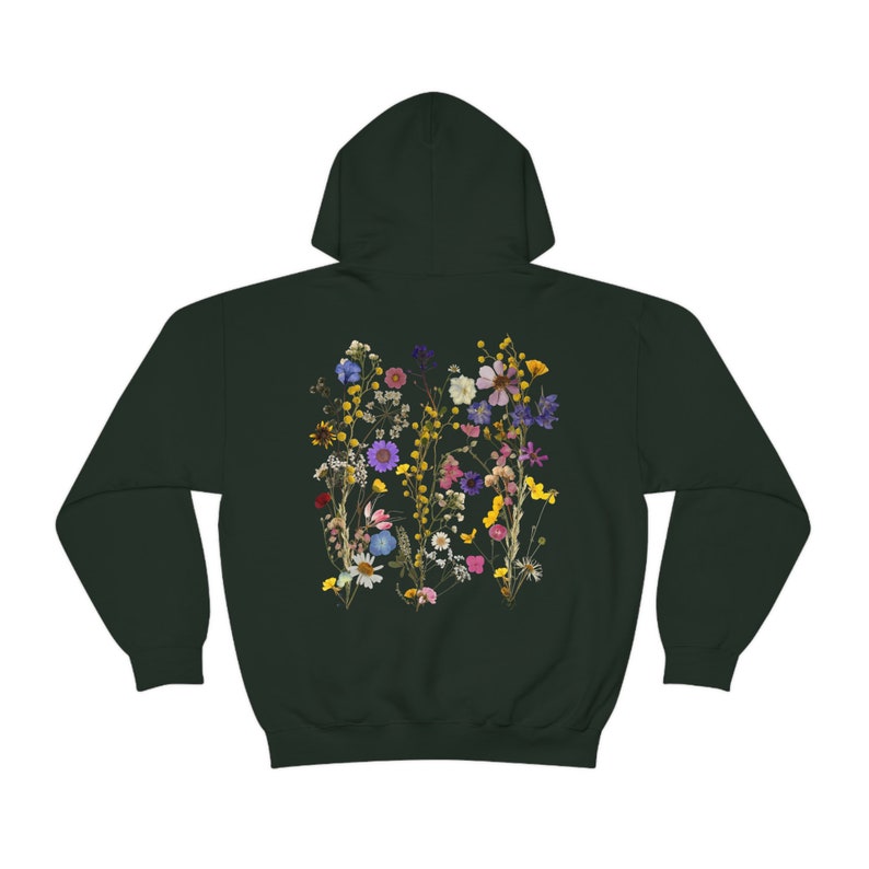 May include: A dark green hooded sweatshirt with a colourful pressed flower design on the back.
