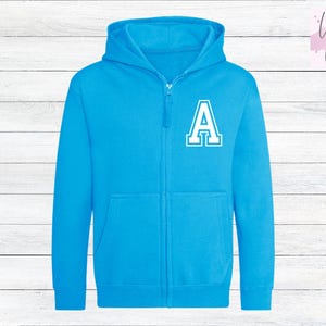 May include: A bright blue zippered hoodie with a white letter 'A' on the front.