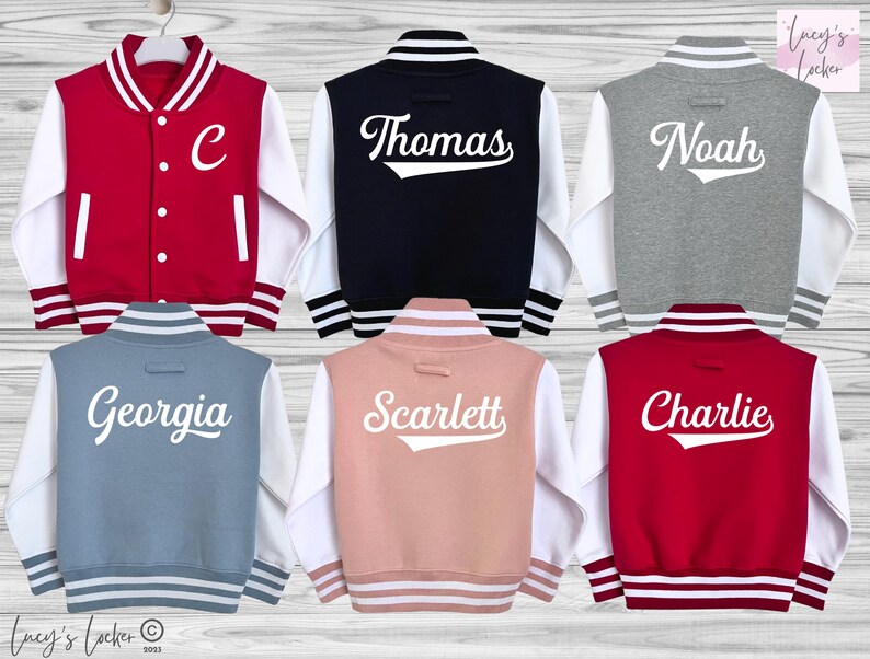 May include: Six varsity jackets in red, navy, grey, blue, pink, and maroon with white sleeves. The jackets feature white striped ribbed collars, cuffs, and hems. Five jackets display white names on the back, while one red jacket shows a white letter C.
