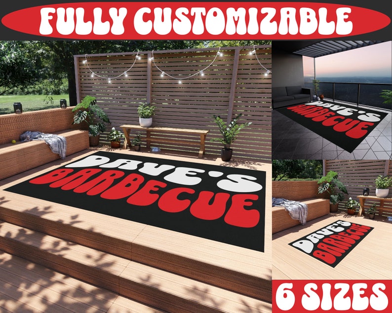 May include: A black outdoor rug with the text "Dave's Barbecue" in white and red letters. The rug is on a wooden deck with a wooden fence and plants in the background. The text "Fully Customizable" and "6 Sizes" are at the top and bottom of the image.
