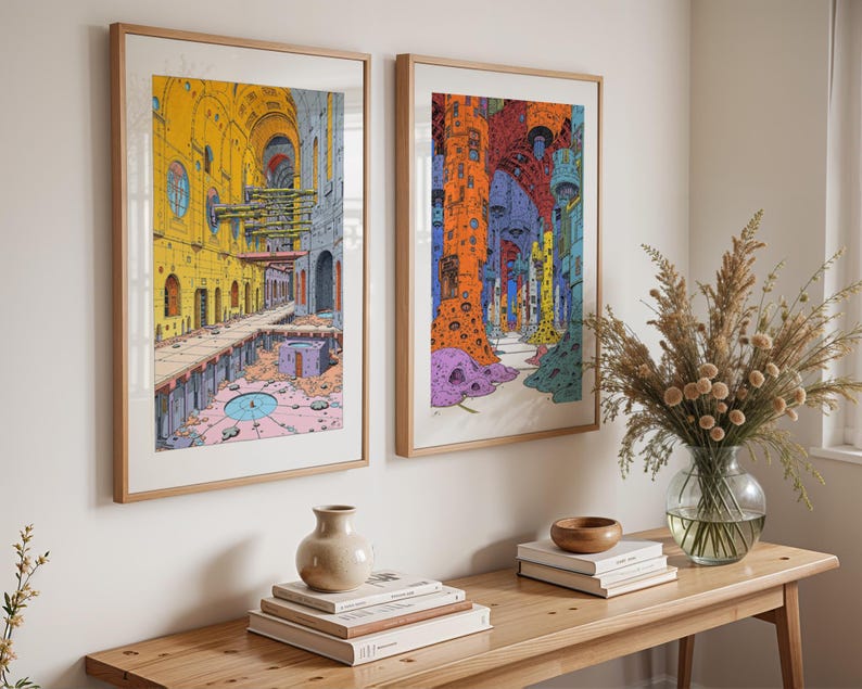 May include: Two framed illustrations of colorful, abstract cityscapes. The illustrations are in a modern style and feature geometric shapes and patterns. The frames are wooden and have a natural finish.
