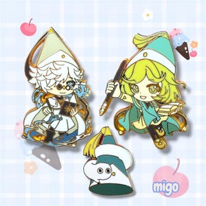 May include: Three enamel pins featuring two anime-style characters in pointed hats and a small white creature. One character holds a book with a star, the other holds a pen and book. The third pin is a pointed hat with a small white creature attached.