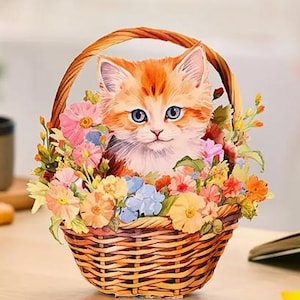 TARJETA EMERGENTE - Adorable adorno 3D desplegable de gato naranja en cesta de flores con sobre, ideal para cualquier ocasión.
