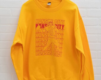 Celebrate the Quarterback's Winning Season with this Cozy Crewneck