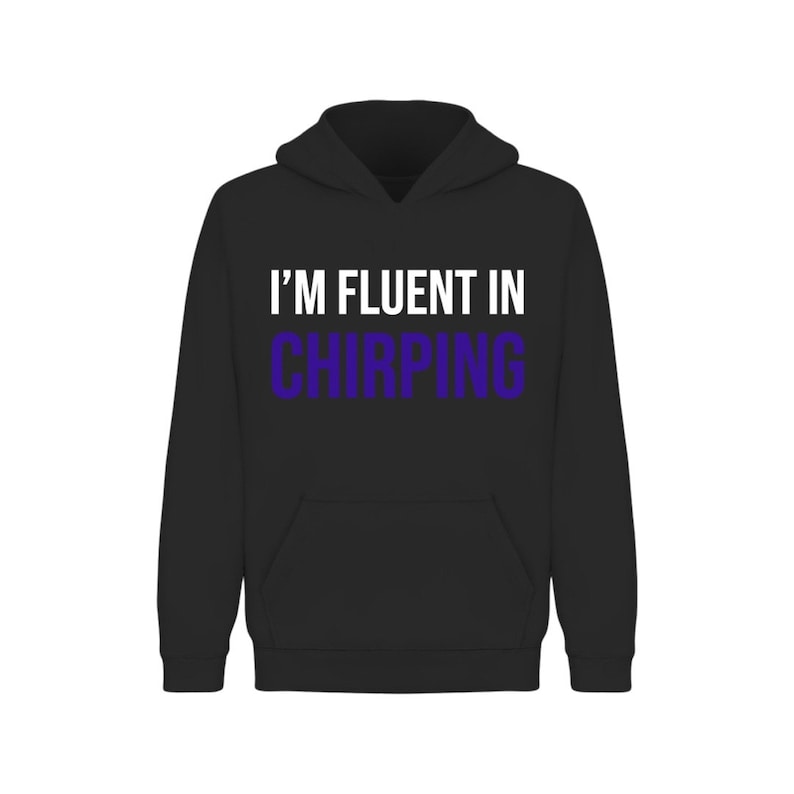 May include: Black hooded sweatshirt with the text "I'M FLUENT IN CHIRPING" in white and purple.