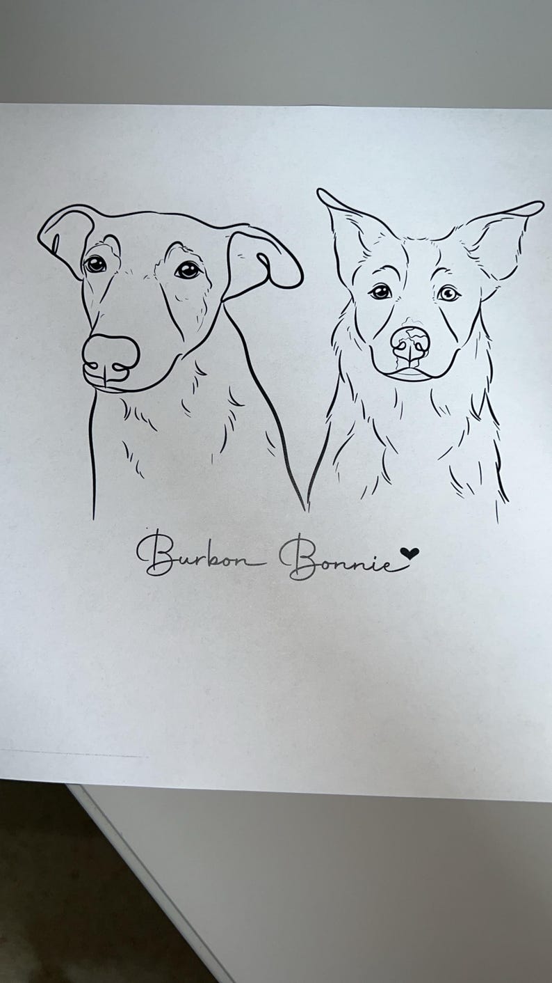 May include: Line drawing of two dogs, Bourbon and Bonnie, with their names written below. The dogs are facing forward with their heads tilted slightly to the side.
