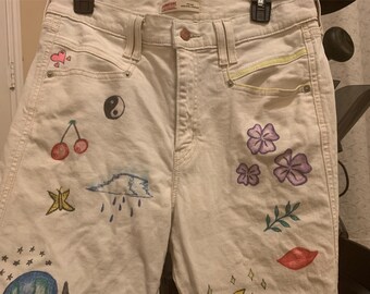 Jeans blancos/crema con diseños de marcadores de tela