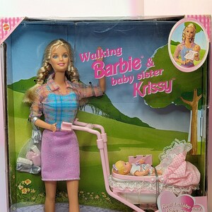 Barbie with baby stroller top