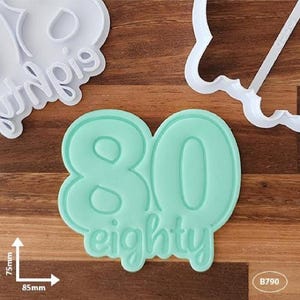 Number 80 with text cookie cutter and fondant stamp. Birthday cookie fun!