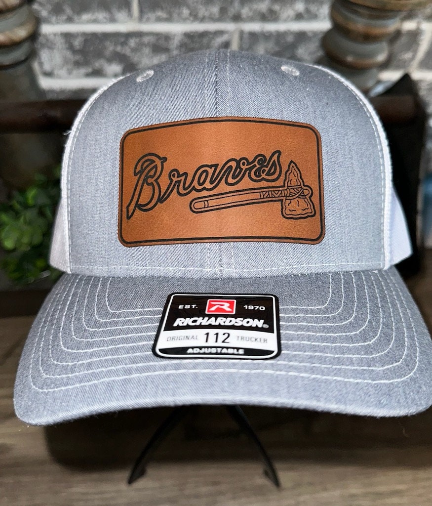 designer patched trucker hat — reworked vintage clothing and much more!