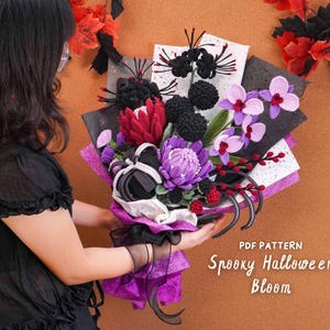 May include: A crochet flower bouquet featuring black, purple, and red blooms, including textured spheres and orchid-like shapes, wrapped in black and purple paper. The text PDF PATTERN Spooky Halloween Bloom is visible in the lower right corner.