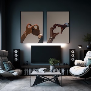 May include: Two framed illustrations of hands making hand gestures. The left image shows two hands forming a circle with their fingers. The right image shows two hands forming a heart shape. Both images have a light brown background.
