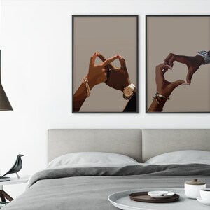 May include: Two black and brown hands forming a heart shape and an infinity symbol on a beige background. The hands are wearing gold bracelets and watches.