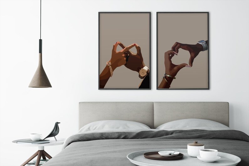 May include: Two black and brown hands forming a heart shape and an infinity symbol on a beige background. The hands are wearing gold bracelets and watches.