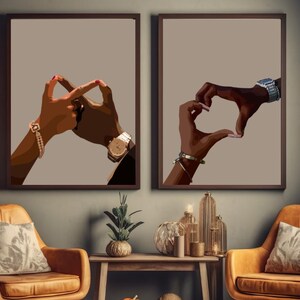 May include: Two framed illustrations of hands forming shapes. The left image shows two hands forming a heart shape. The right image shows two hands forming a circle.