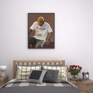 May include: A framed illustration of a person wearing a white t-shirt with the text "Listen to God." The person is wearing a brown hat and sitting on a brown surface.