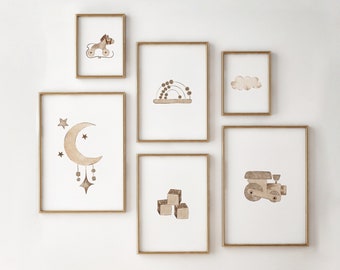 May include: A set of six gold framed prints with various illustrations. The prints feature a crescent moon with stars, a rainbow, a cloud, a toy train, a toy truck, and a stack of blocks.
