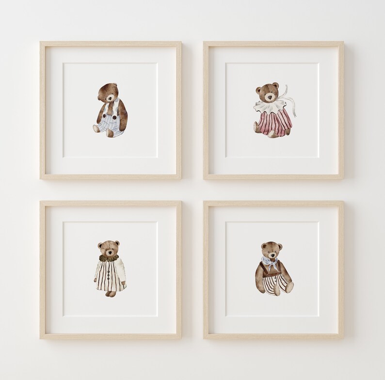 May include: Four framed prints of watercolor illustrations of teddy bears wearing different outfits. Each print features a brown teddy bear with a different colored outfit. The first print features a teddy bear wearing blue overalls, the second print features a teddy bear wearing a pink and white striped dress, the third print features a teddy bear wearing a white and black striped dress, and the fourth print features a teddy bear wearing a blue and white striped dress.