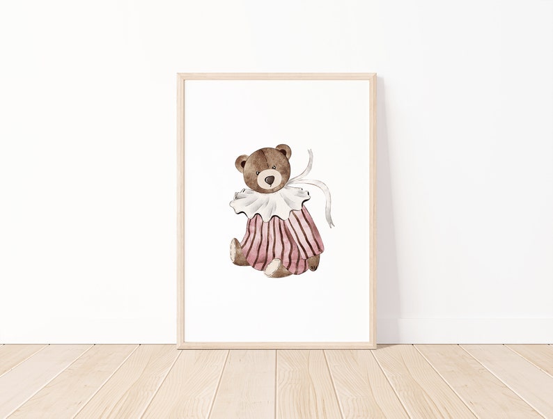 May include: A watercolor illustration of a brown teddy bear wearing a pink and white striped dress with a white collar and a white ribbon.