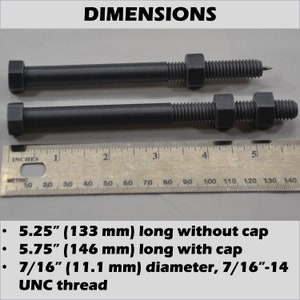 May include: Two gray metal bolts with hexagonal heads and nuts. The bolts are 5.25 inches (133 mm) long without the cap and 5.75 inches (146 mm) long with the cap. The bolts have a 7/16 inch (11.1 mm) diameter and a 7/16-14 UNC thread.