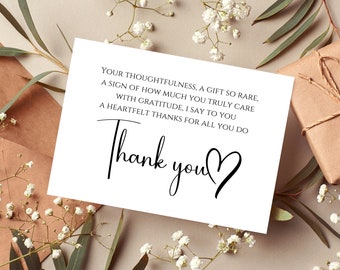 May include: A white card with black text that reads "YOUR THOUGHTFULNESS, A GIFT SO RARE. A SIGN OF HOW MUCH YOU TRULY CARE WITH GRATITUDE, I SAY TO YOU A HEARTFELT THANKS FOR ALL YOU DO Thank you".