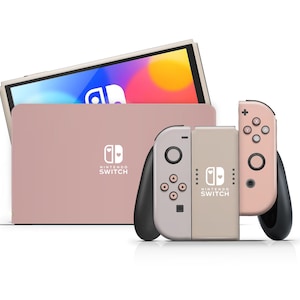 Peut inclure: Une console Nintendo Switch rose avec deux manettes Joy-Con roses. La console est fermée et les manettes Joy-Con sont attachées. La console a un logo Nintendo Switch blanc avec deux cœurs.