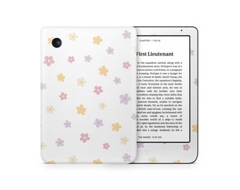 May include: White e-reader with a floral pattern in pastel colors. The cover displays a repeating pattern of pink, yellow, and lavender flowers. The screen shows text from a book. The e-reader is open, displaying the text "First Lieutenant".