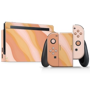 May include: A set of Nintendo Switch console and Joy-Con controllers with a custom skin featuring an abstract wavy pattern in peach, pink and orange.