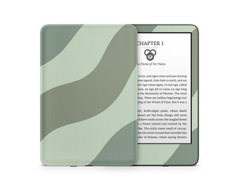 Könnte beinhalten: Eine grüne und graue gemusterte Kindle E-Reader Hülle mit einem weißen Bildschirm, auf dem der Text "KAPITEL 1" und "Die Flamme von Tar Valon" angezeigt wird.