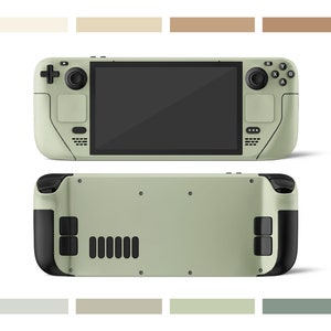 Puede incluir: Una consola de juegos portátil verde con botones negros y una pantalla. La consola tiene una superficie texturizada y se muestra desde el frente y la parte posterior.