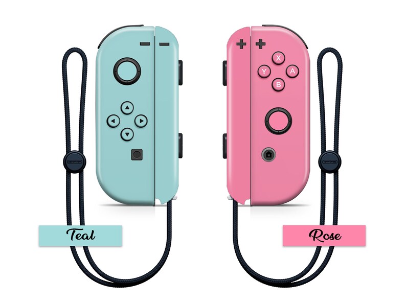 K&ouml;nnte beinhalten: Zwei Nintendo Switch Joy-Con-Controller, einer in T&uuml;rkis und einer in Rosa, mit schwarzen Handgelenksb&auml;ndern. Der t&uuml;rkisfarbene Controller hat die Worte "Teal" darunter gedruckt. Der rosafarbene Controller hat die Worte "Rose" darunter gedruckt.