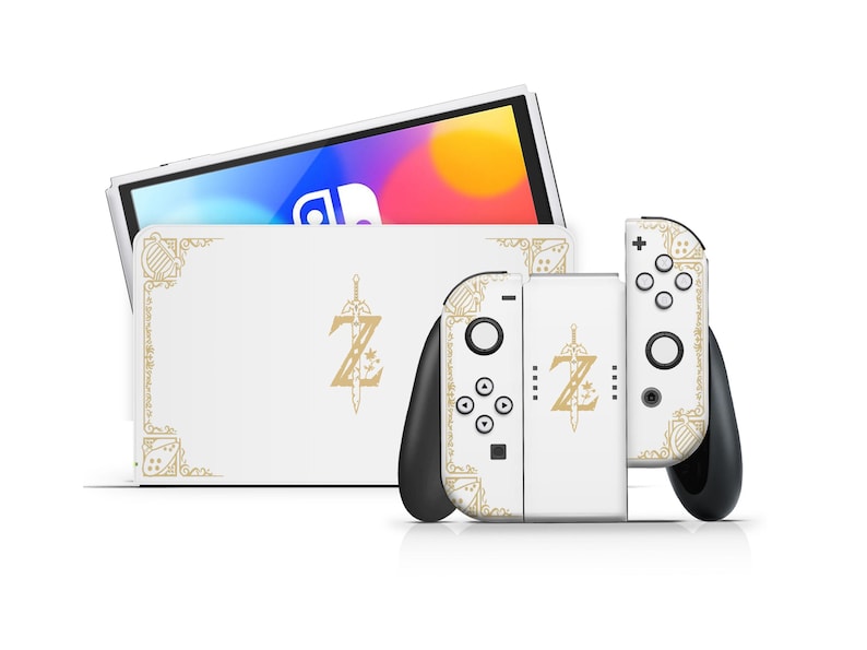 May include: White Nintendo Switch console and Joy-Con controllers with a custom skin featuring a gold Zelda logo and decorative border.