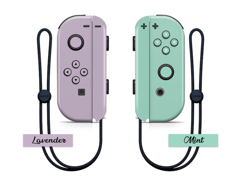 K&ouml;nnte beinhalten: Zwei Nintendo Switch Joy-Con-Controller, einer in Lavendel und einer in Mintgr&uuml;n, mit schwarzen Handgelenksb&auml;ndern. Die Controller sind nebeneinander mit den Etiketten "Lavender" und "Mint" darunter abgebildet.