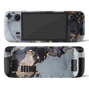 May include: A handheld gaming device with a black and white marble design. The device has a screen, buttons, and a joystick.