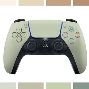 Può includere: Un controller wireless PlayStation 5 DualSense di colore verde chiaro con dettagli neri e pulsanti blu.