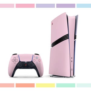 May include: A pink PlayStation 5 console with a matching pink controller. The console has a sleek, modern design with a black stripe running down the side. The controller has a standard PlayStation layout with a touchpad and buttons.