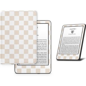 May include: A white and beige checkered Kindle e-reader case with a black Kindle e-reader displaying the text "Chapter 1 The Wheel of Time" on the screen.