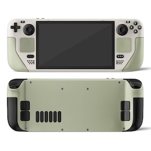 May include: A handheld gaming console with a light green and white color scheme. The console has a large screen, two joysticks, and a variety of buttons. The back of the console is a solid light green color.
