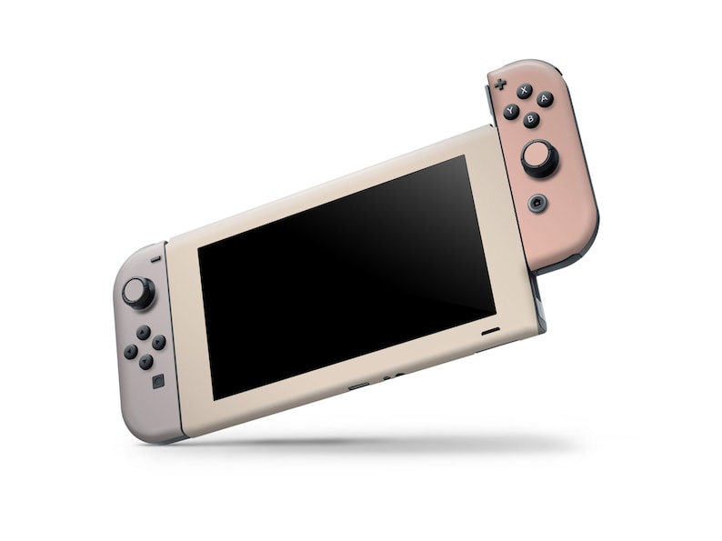 May include: A light beige Nintendo Switch console with a rose gold Joy-Con controller attached. The console has a black screen and a gray button on the left side.