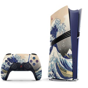 May include: A blue and white PlayStation 5 console and controller with a Japanese wave design. The console is a vertical design with a blue and white wave pattern on the front. The controller is a standard PlayStation 5 controller with the same wave pattern on the front.