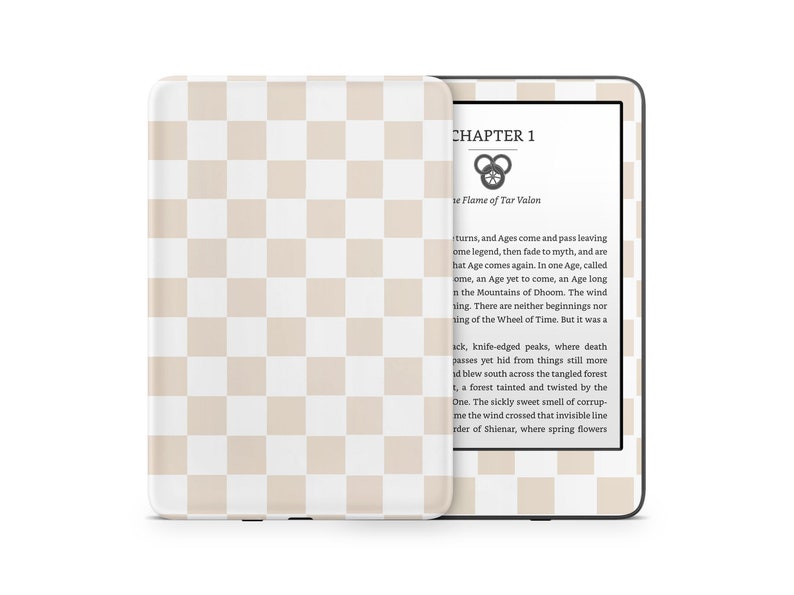 May include: A white and beige checkered pattern on a Kindle e-reader. The screen displays the text "CHAPTER 1" and "The Flame of Tar Valon". The text continues with a passage about the Wheel of Time.