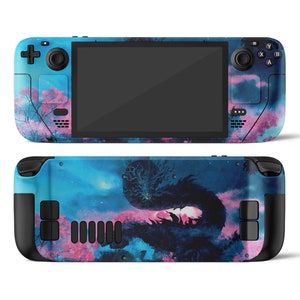 Könnte beinhalten: Eine blaue und rosa Handheld-Spielkonsole mit einem Drachen-Design. Die Konsole hat einen schwarzen Bildschirm und Knöpfe.
