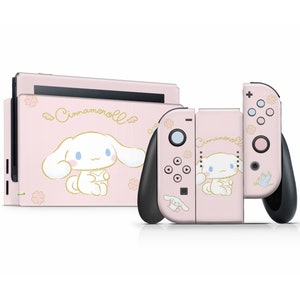 May include: Pink Nintendo Switch console and Joy-Con controllers with a Cinnamoroll design. The console and controllers feature a pink background with a white Cinnamoroll character and floral accents.