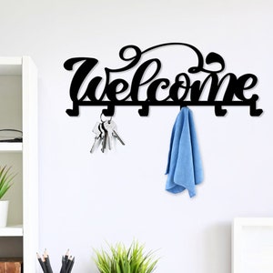 Colgador de llaves de metal con la palabra "Bienvenido a casa" - Ganchos de metal para decoración de habitaciones con estilo - Soporte de llaves de metal con la palabra "Bienvenido a casa" - Arte de pared de metal como regalo de inauguración de la casa - Regalo de cumpleaños