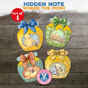 May include: Set of four Winnie the Pooh-themed paper cutouts shaped like honey jars. Each jar features a different illustration of Winnie the Pooh and friends, with decorative bows and the text "Hidden Note Winnie the Pooh".