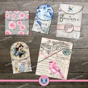 May include: A collection of five decorative paper envelopes featuring various designs including pink roses on a gray background, blue birds on a white background, a Brooklyn-themed envelope, a birdhouse illustration, and a pink bird on vintage script.