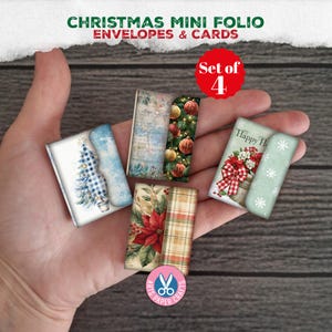 May include: A set of four Christmas mini folios featuring envelopes and cards with festive designs including a blue gingham tree, vintage script, poinsettias, and red ornaments. The text reads Christmas Mini Folio Envelopes & Cards.