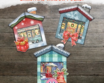 May include: Three house-shaped paper pocket tags labeled POCKET TAGS CHRISTMAS WINDOW POCKET. Each tag features a snowy roof and a festive scene: a bookstore with a gift, a shop with a red bow, and a winter scene with a bell and red sleigh.
