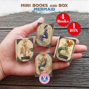 May include: A set of miniature books with mermaid illustrations. The set includes four books and one box. Each book features a different mermaid design with vintage-style frames. The text "MERMAIDS" is visible on some books.